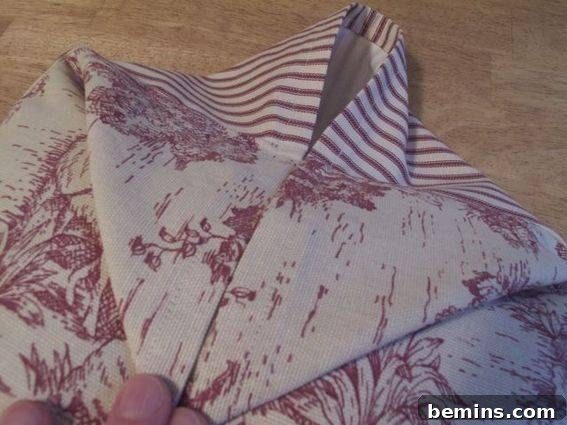 Crafting a Timeless Button Pillow: A DIY Guide 9 Pulling Down Front Fabric