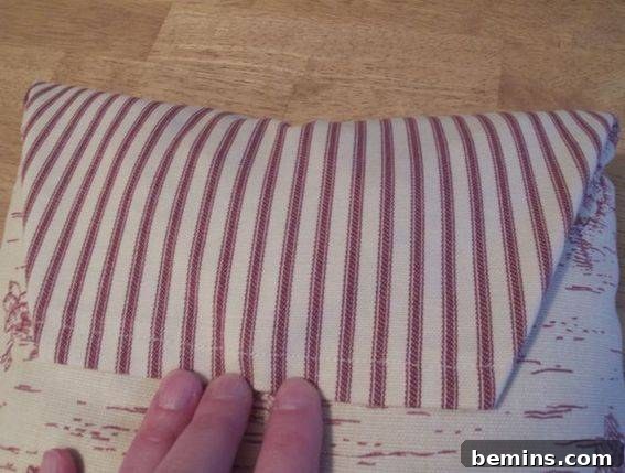 Crafting a Timeless Button Pillow: A DIY Guide 10 Pulling Down Back Fabric