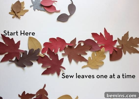 Sewing leaves together. Carefully attaching each leaf to create a seamless runner.