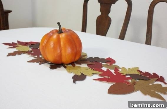 Faux leather leaf table runner on a table. The finished product adding a touch of fall elegance.