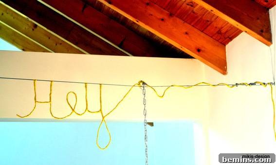 The finished DIY chandelier illuminating the room.
