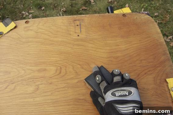 Sanding and coating the wooden desktop.