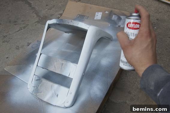 Spraying the seat with 'diamond dust' Glitterblast paint.