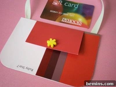 Creative Christmas: 8 DIY Paint Chip Card & Tag Projects 8 Upcycled Gift Card Presentation: A creatively crafted paint chip handbag, serving as a unique and eco-friendly way to present a gift card.