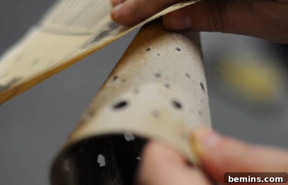 Crafting Contemporary Perforated Christmas Trees 4 Drilling holes into the paper mache cone.