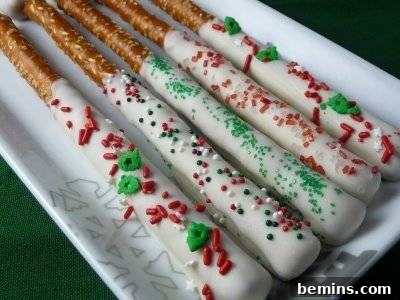 Pretzels rolled in white chocolate and sprinkles.