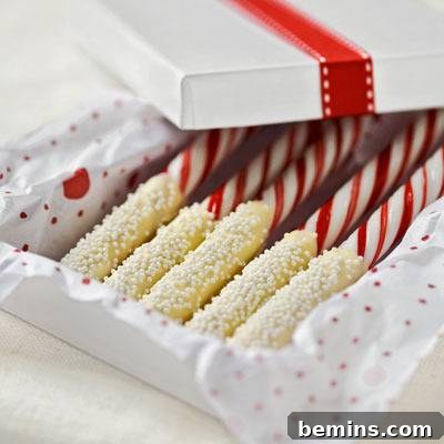 Open box of white chocolate covered candy canes.