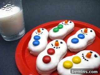 Desserts that look like snowmen on a red platter.
