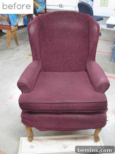 Top 10 Furniture Flips That Still Inspire 3 A close-up shot of a reupholstered chair showcasing the detailed fabric work.