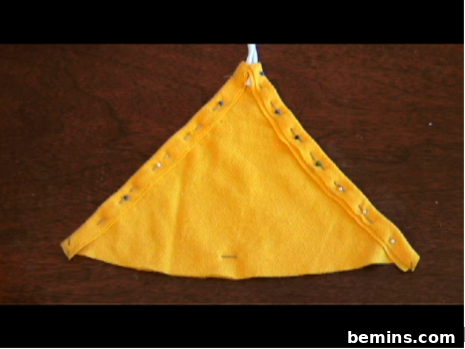 Sewing the sides of the triangle