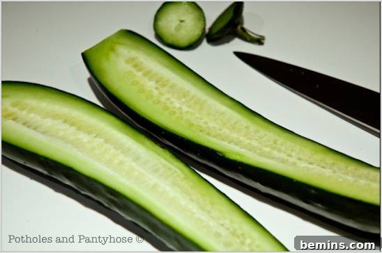 Slice cucumber in half