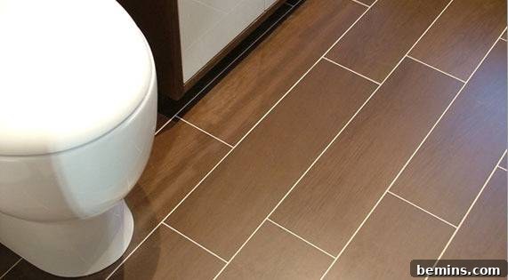 Bathroom Featuring Rectangle Shaped Wood Look Tiles