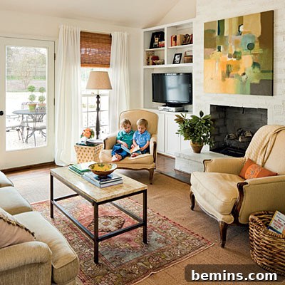 A stylish kitchen featuring a television, demonstrating the integration of technology in modern home design.