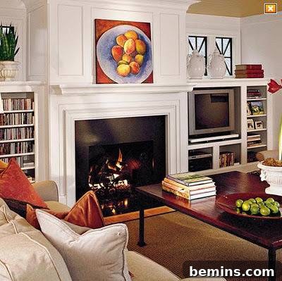 A living room showcases a TV cleverly concealed behind sliding panels, demonstrating a sophisticated design approach.
