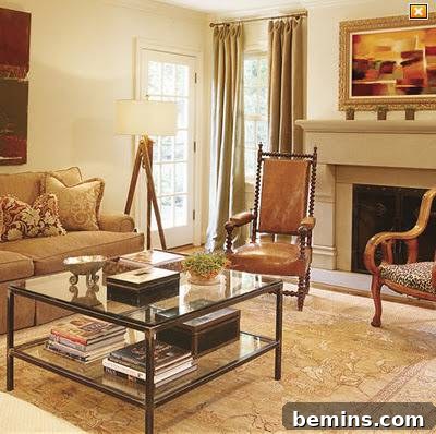 A well-designed living room features seating, a large coffee table, and a fireplace, with a hidden TV enhancing the room's aesthetic appeal.