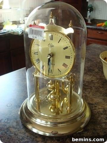 A simple clock kept inside the glass, before conversion to a cloche.