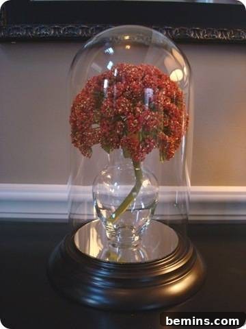 A clock turned into an elegant cloche display, showcasing its new decorative purpose.