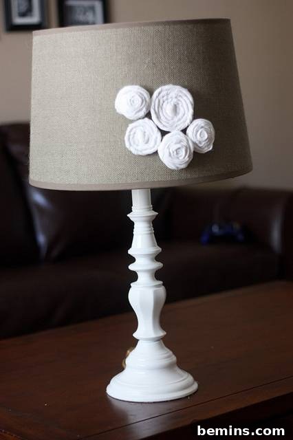 Brass lamp painted white with rosettes on the shade