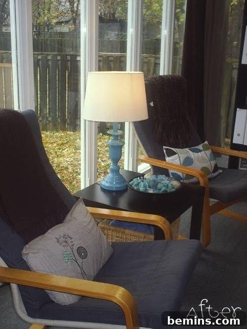 A revitalized nightlamp placed between two chairs, enhancing the ambiance.