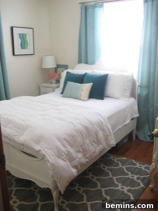 Small 9x9 bedroom with white and turquoise color scheme
