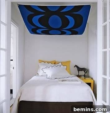 Small alcove bedroom with fabric canopy