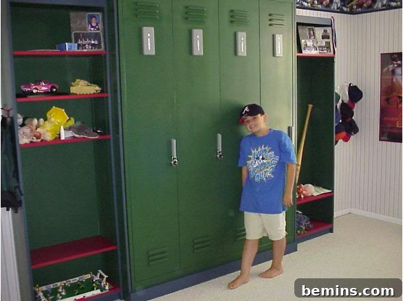 A young boy in a dark baseball cap leaning against a row of tall green lockers.