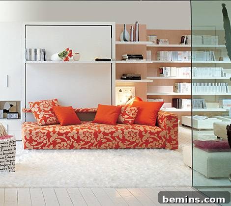 An orange and white sofa sits in a room full of book shelves.