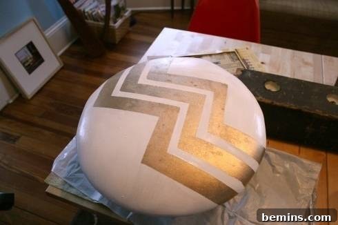 The seat cushion with a white chevron pattern on a gold background.