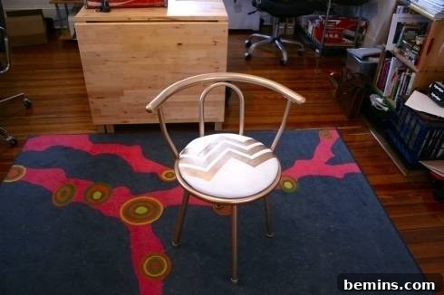 The finished DIY glam chair in a home setting.