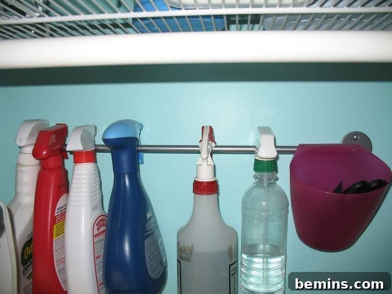 Top Laundry Room Transformations 47 Cleaning spray bottles hang on a metal bar