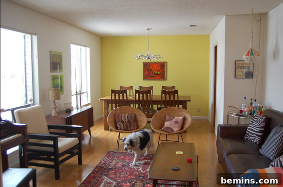 A room with colorful decor distracting from popcorn ceiling