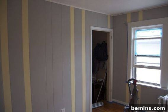 Yellow stripes, not so good - The initial striped design did not complement the nursery space.