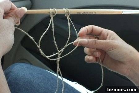 Woman's hands displaying looped hemp twine
