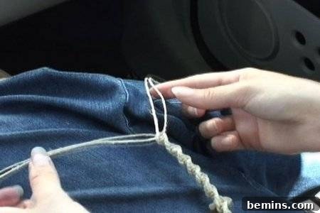 Hands holding twisted hemp twine