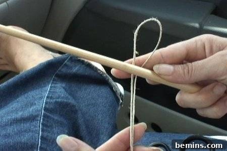Looping hemp twine over a stick
