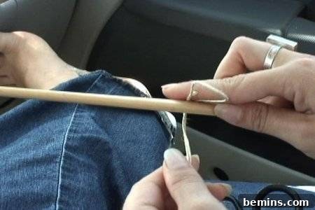 Folding hemp twine around a dowel rod
