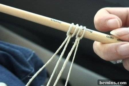 Stick with looped hemp twine