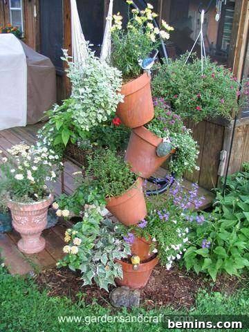 A vertical potted plant hanger tipsy tower style.
