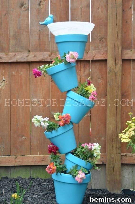 A colorful topsy turvy bird bath.
