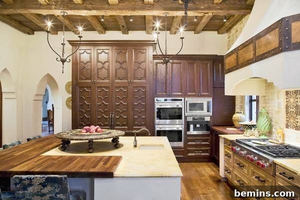 A kitchen island featuring a combination of wood and limestone countertops, creating a visually appealing contrast.