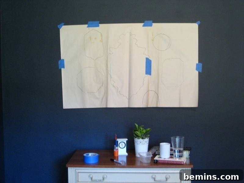 Crafting Your Perfect Gallery Wall 7 Using butcher paper to mark nail placement for a gallery wall