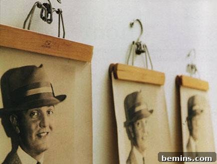 Creative DIY Photo Displays: 10 Unique Wall Art Ideas 4 A DIY grid display with photographs held by pant hangers.