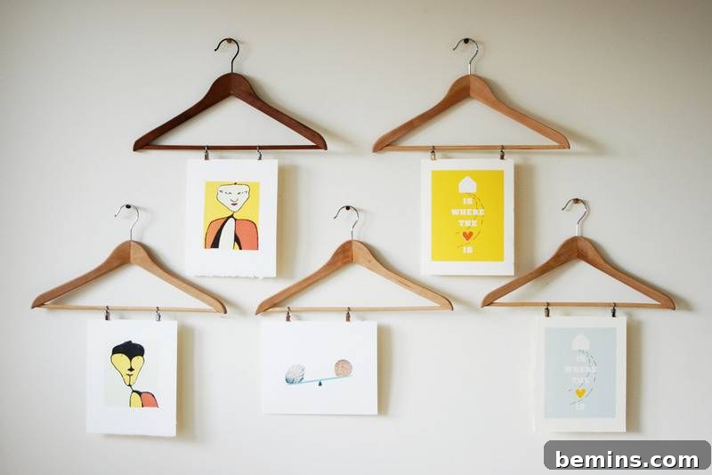 Wall arts hanging on wooden clipboards.