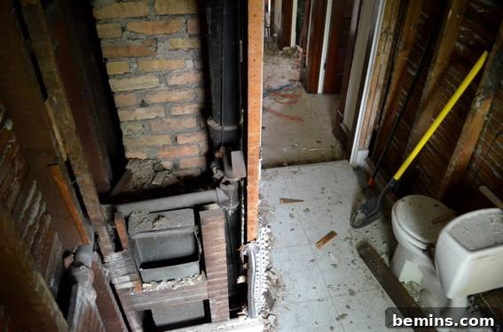 Demolished Bathroom Interior with Chimney