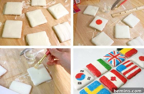 Person making country flags by painting on square pieces.