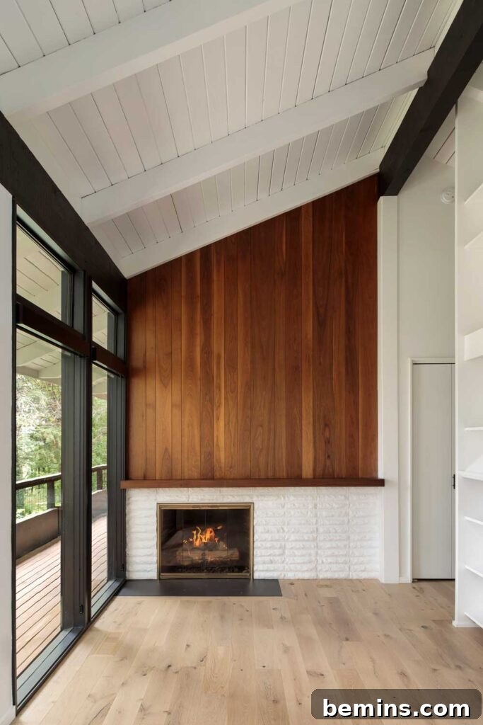 Inspired Fireplace Tile Designs for a Warm Home 22 The classic mid-century fireplace with a wood accent wall from All Wood Group.