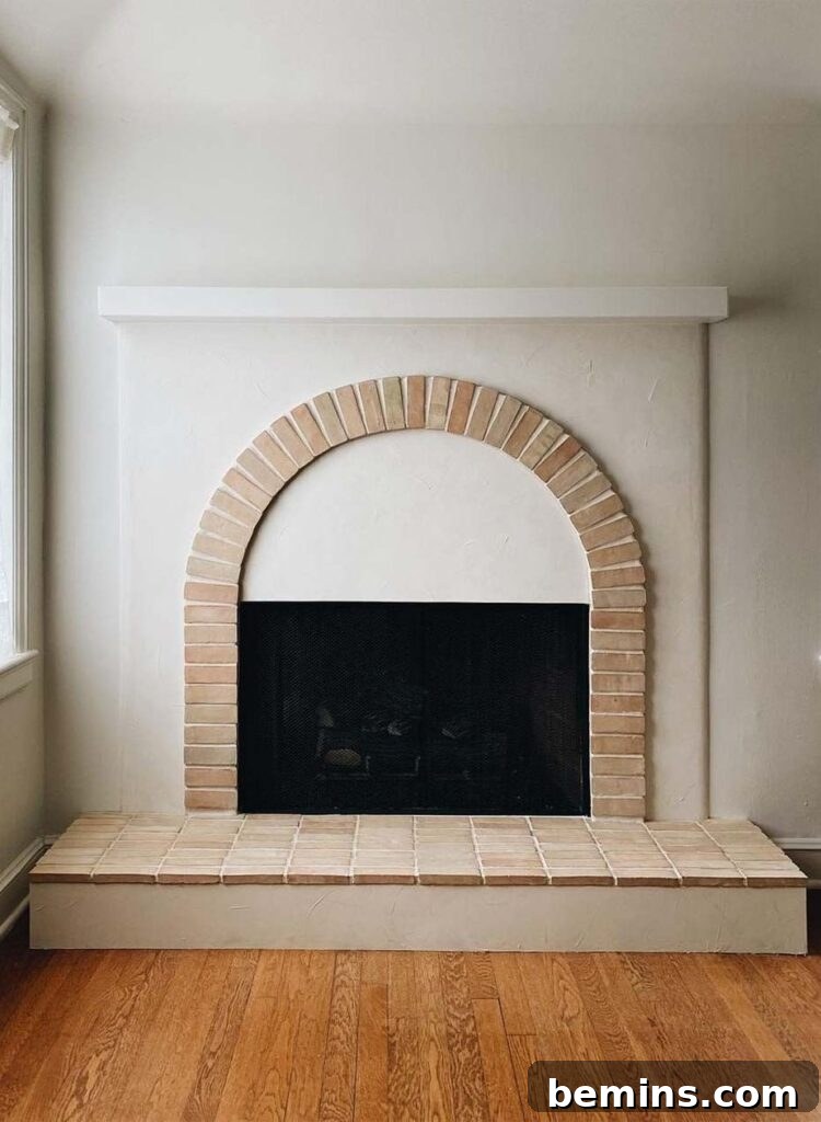 Inspired Fireplace Tile Designs for a Warm Home 9 Archway brick fireplace from Cle Tiles