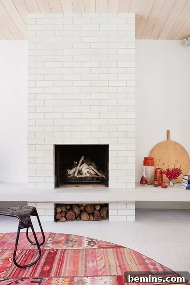 Inspired Fireplace Tile Designs for a Warm Home 10 Clean and contemporary white washed brick fireplace from Clare Cousins Architects.