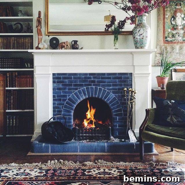 Traditional blue tile fireplace with a simple white mantle.