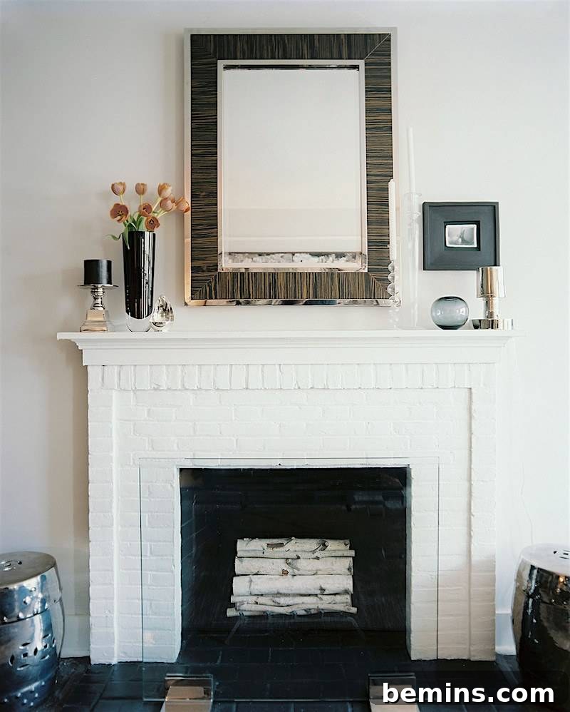 Painted white brick fireplace with a classic white mantel.